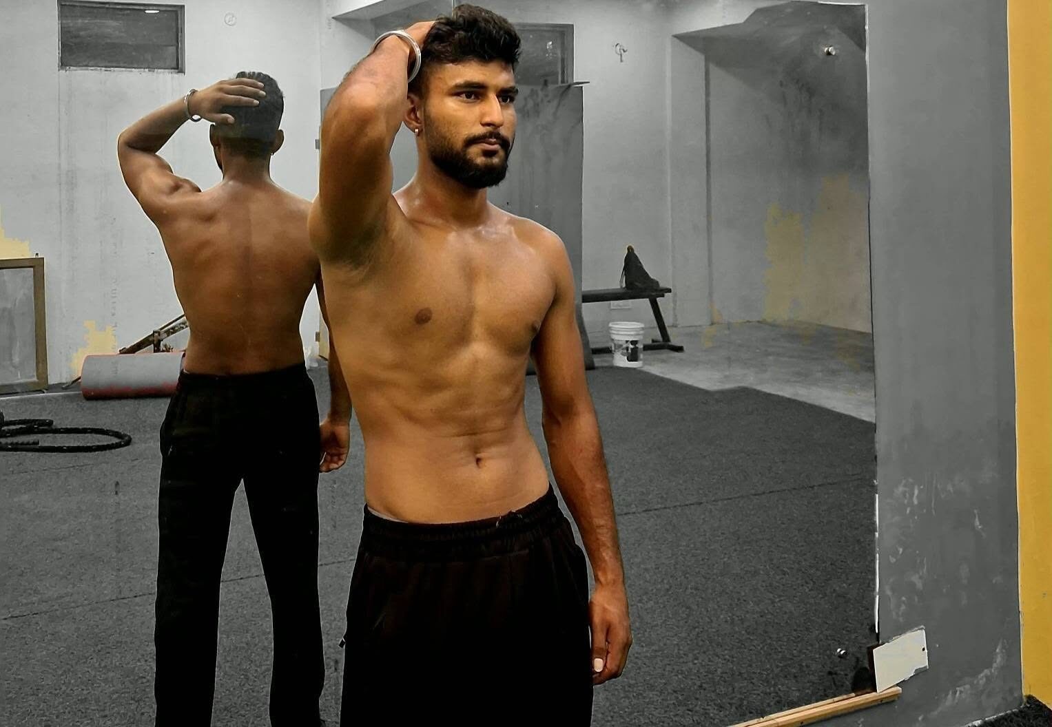 Uttam Yadav training on the gym floor in Biratnagar, Nepal